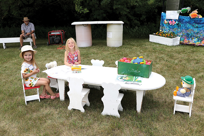 Airlie Bonkowski and Zoey were enjoying arts and crafts at the New Finland District�s celebration of 135 years, on June 24.<br />
